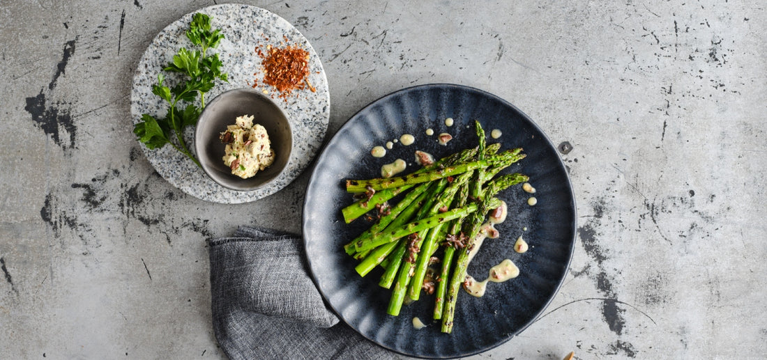 Chargrilled asparagus with biltong, garlic and olive butter