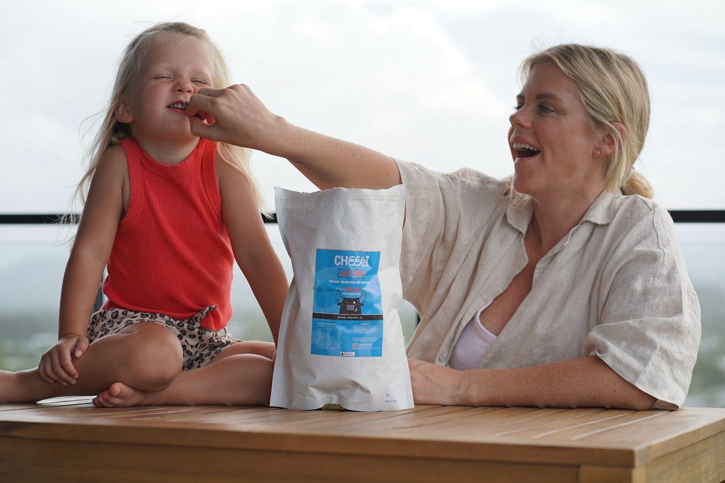 Rebecca from Healthier with Bec sharing Cheeki OG bulk biltong with her daughter